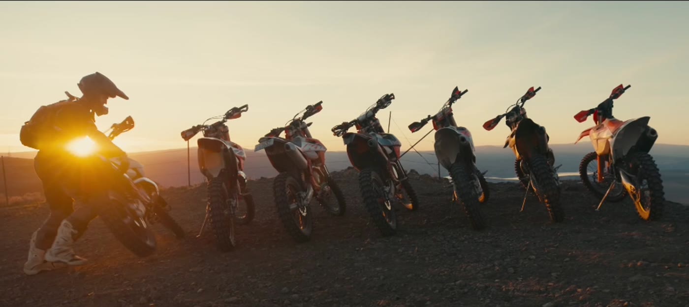 Washington Riders on dirt bikes crossing open terrain